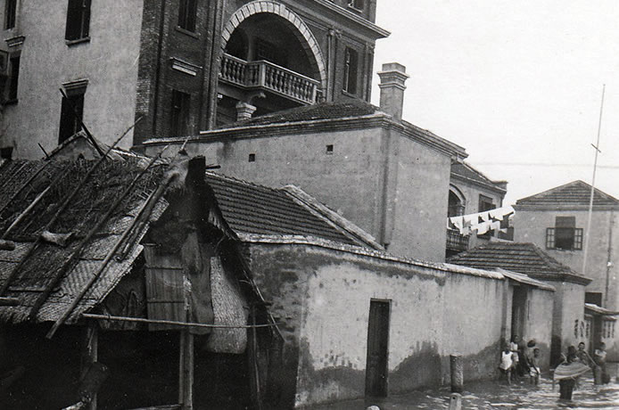 On the edge of the Yangtse River showing one of the many evacuated mat houses