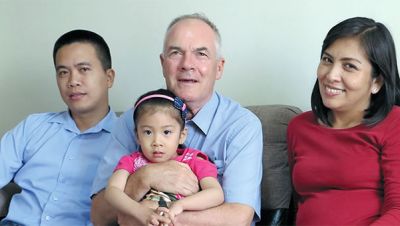 Charito, Fr. John holding Camile and Marisol in Peru